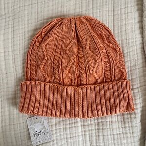 Free People Stormi Washed Cable Beanie in the color butterscotch